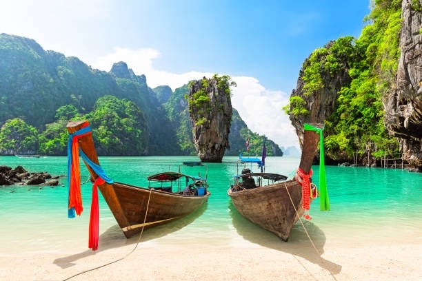 Explore Phang Nga Bay by riding a longtail boat.