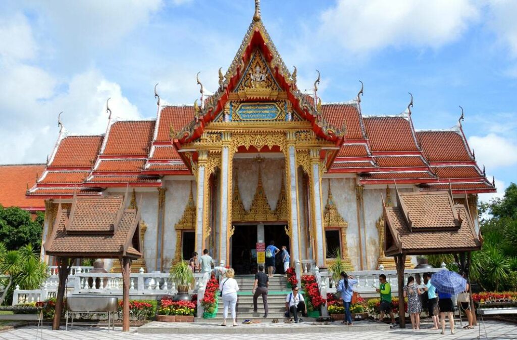 Visit the Wat Chalong Buddhist temple.