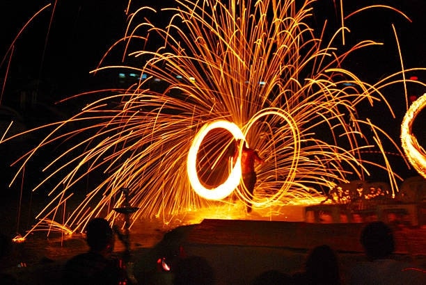 Watch fire shows and acrobatic performances