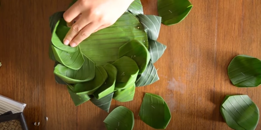 Attach the cone-shaped leaf to the decorated base