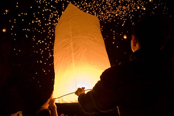 Light the lanterns and release them into the night sky