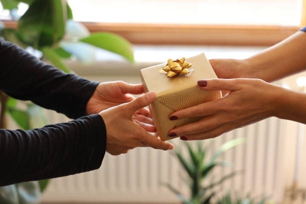 Offer gifts with both hands as a sign of respect