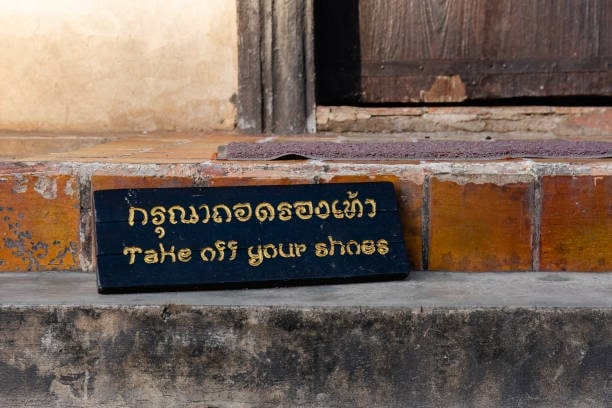 Remove shoes before entering homes and temples