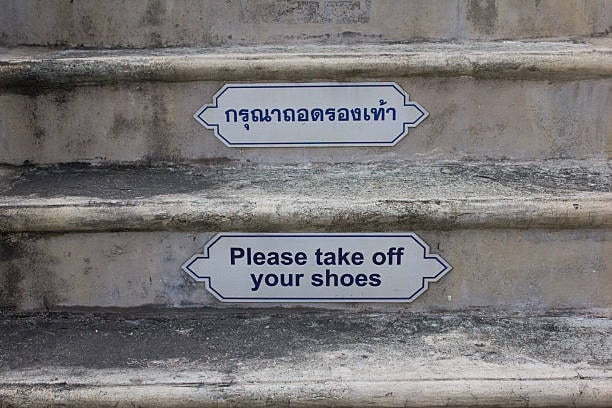 Remove shoes before entering temple buildings