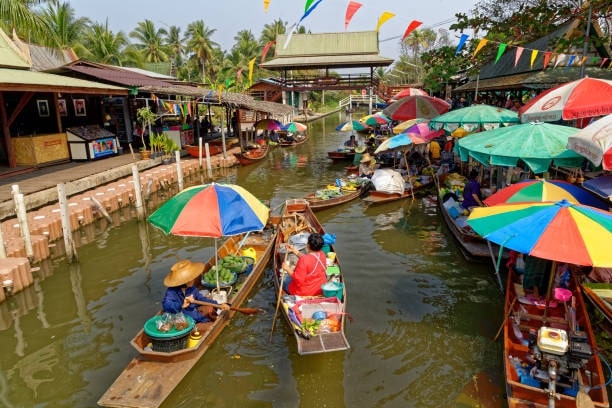 Take a boat ride and explore Tha Kha Floating Market