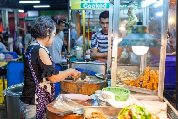 Try traditional Thai street food at the local market