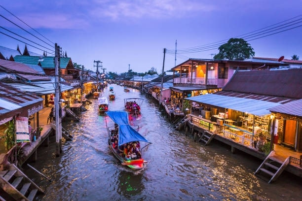 Visit the Amphawa Floating Market