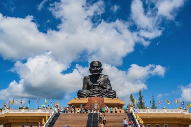 Visit the impressive Wat Huay Mongkol temple