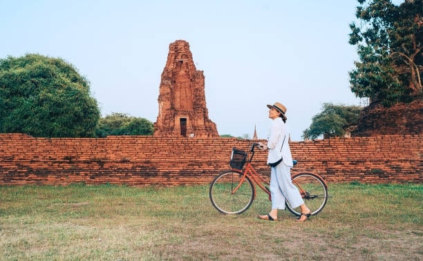 Woman walking with a bicycle