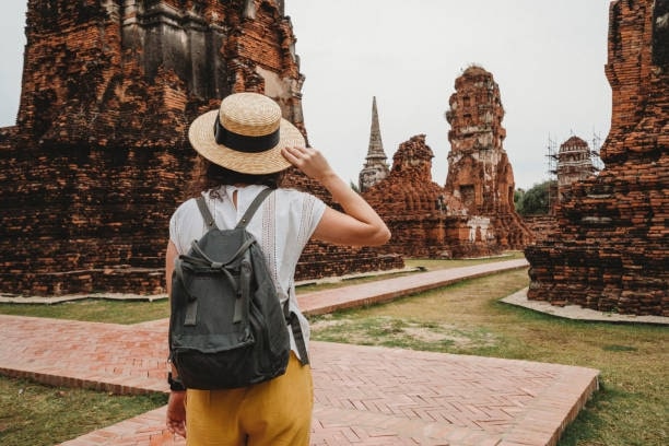 Young woman exploring a temple in Ayutthaya, Thailand